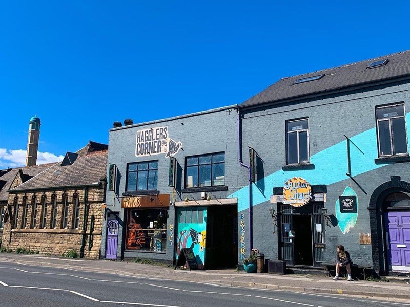 hagglers corner blue sky blue building