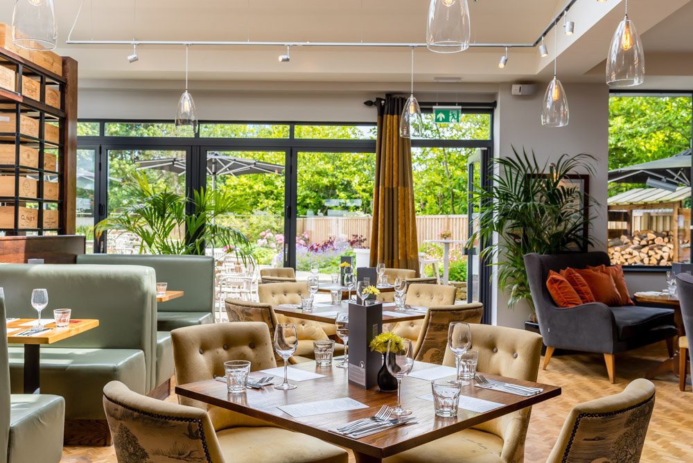 a restaurant with tables and chairs the highfield