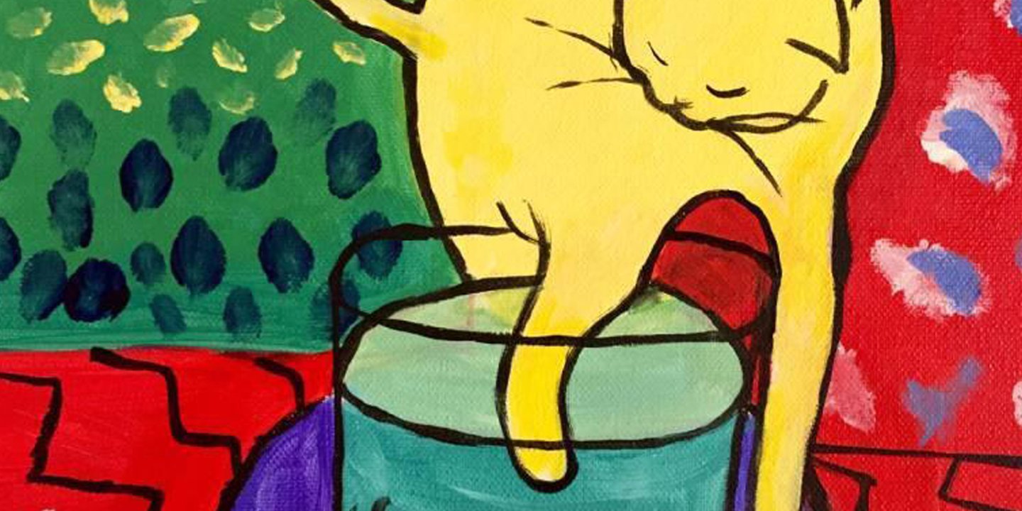 yellow cat with fish bowl